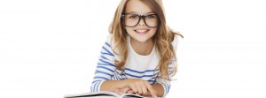 girl with glasses smiling lying on book